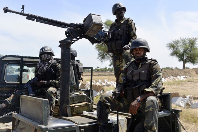 Cameroonian soldiers patrol on 12 November 2014 in Amchide, northern Cameroon.