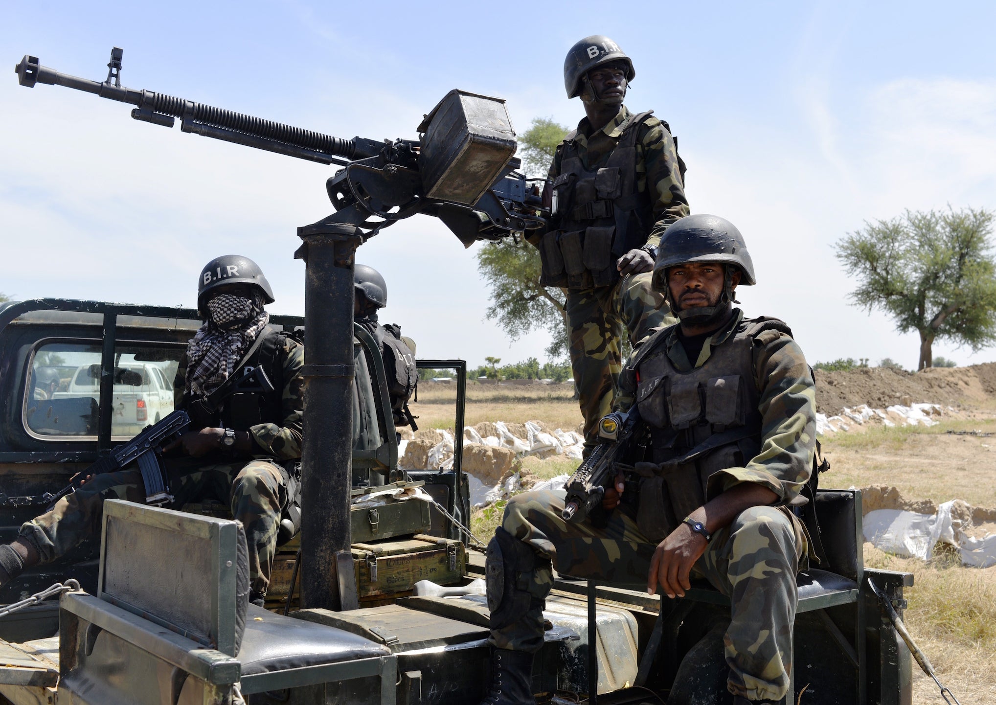 Cameroonian soldiers patrol on 12 November 2014 in Amchide, northern Cameroon.