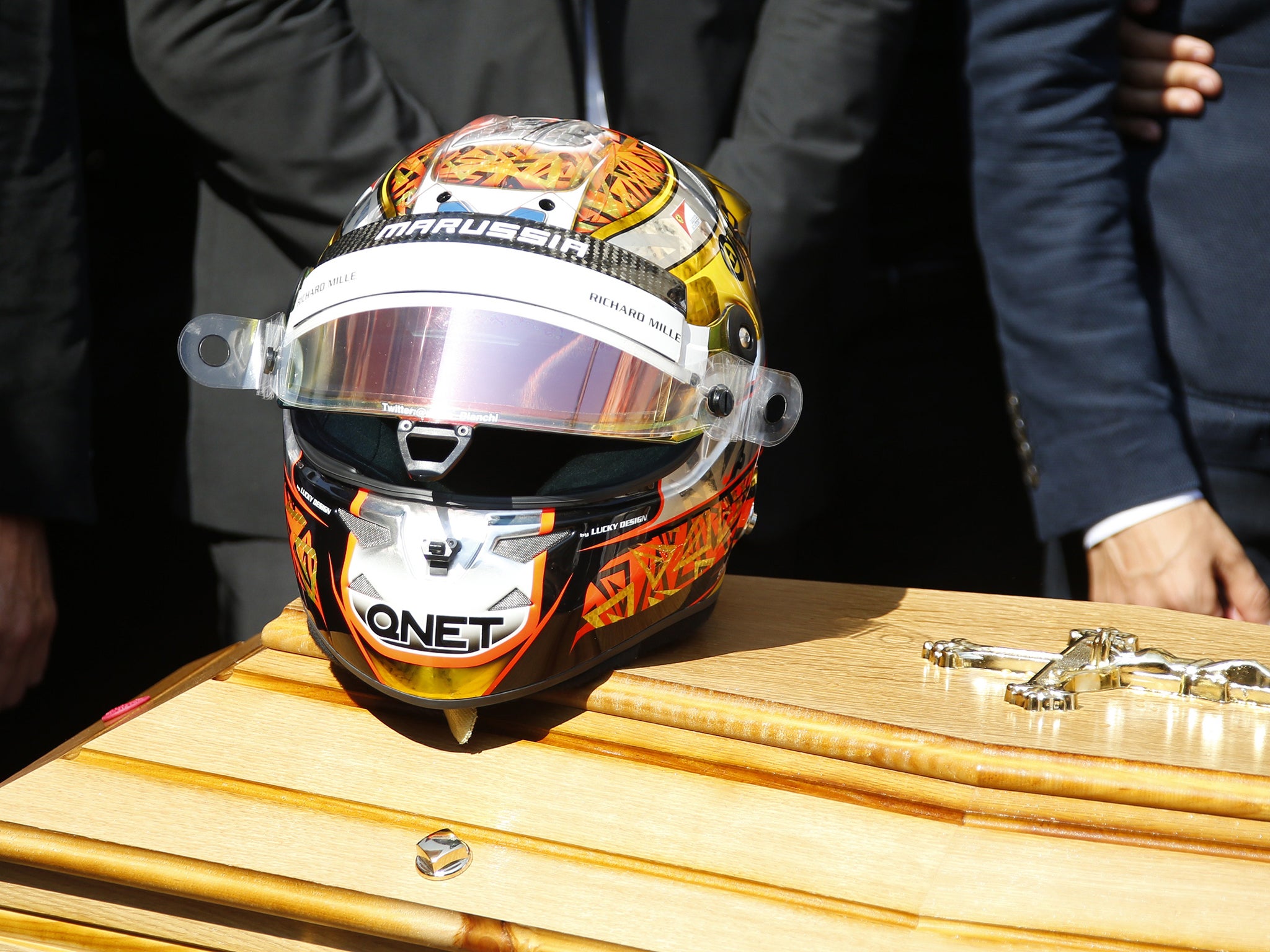 Late French Formula 1 driver Jules Bianchi's helmet is pictured on his coffin