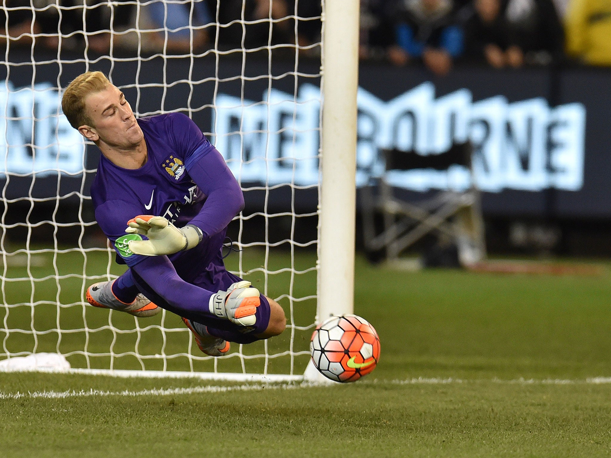 Joe Hart saves a penalty in a pre-season shoot-out victory for Manchester City over Roma