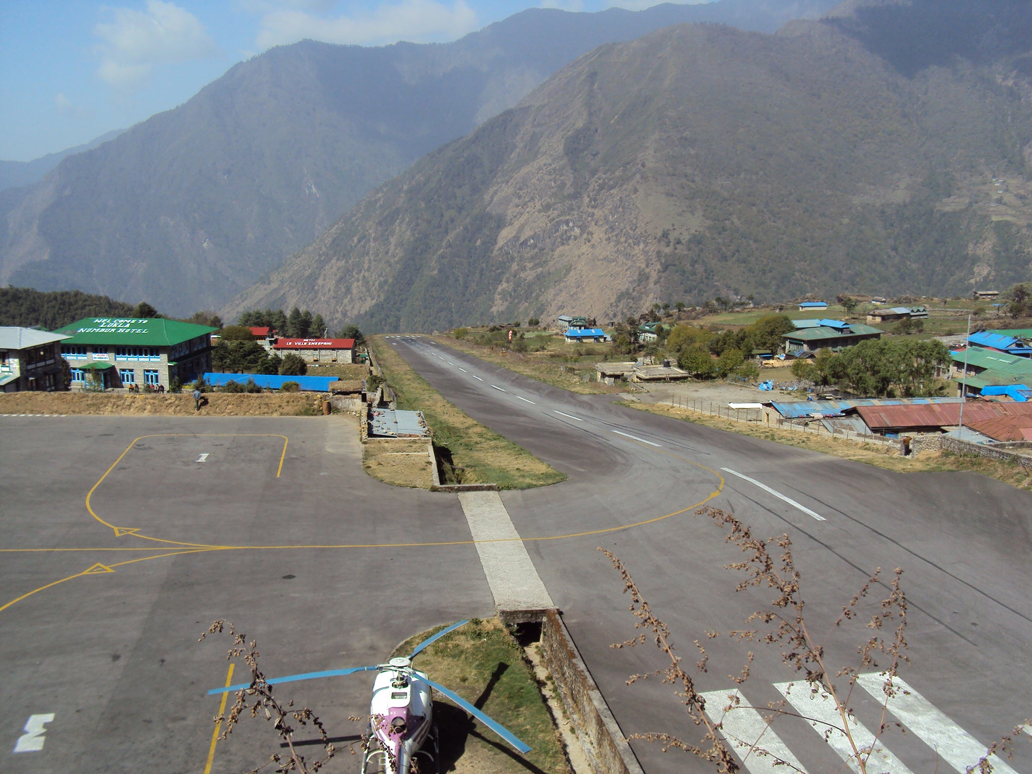 Pilots need to take caution at Tenzing-Hillary Airport in Nepal, what with the sloping runway (Picture: Wikimedia/Jeremy Broomfield)