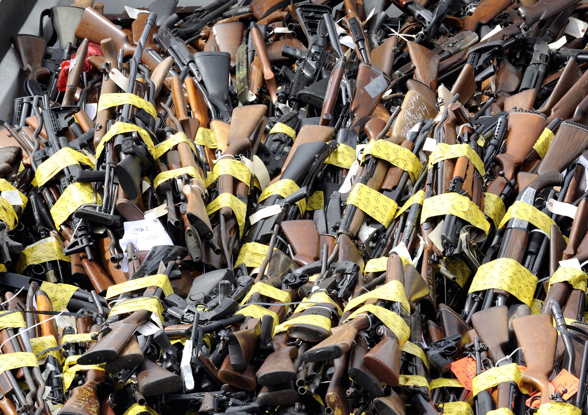 Approximately 3,400 confiscated weapons sit inside a dump truck during the 22nd Annual Gun Melt in Rancho Cucamonga, California on 6 July 2015.