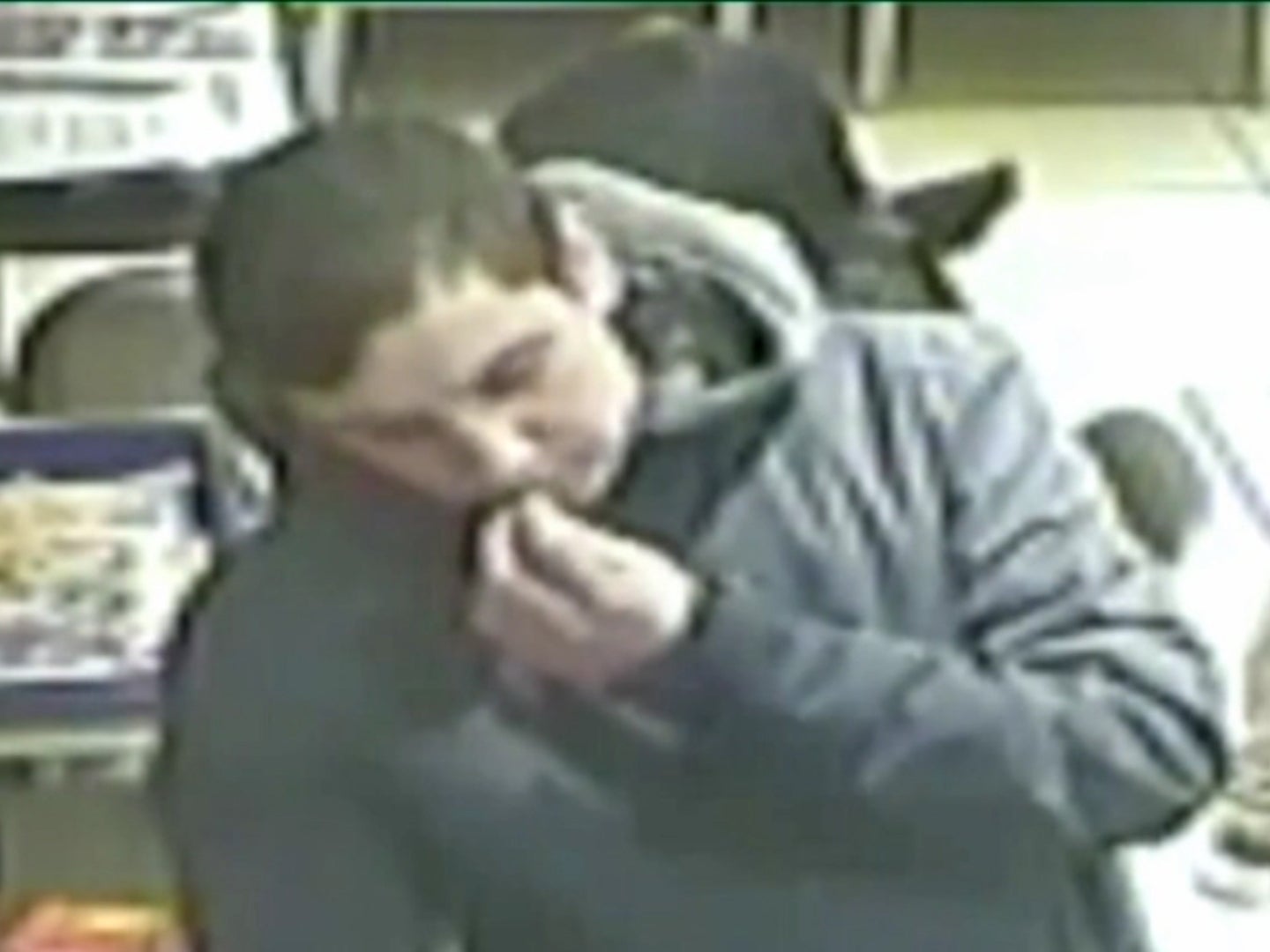 The thief feigning confusion while stealing phone under the nose of unsuspecting victim