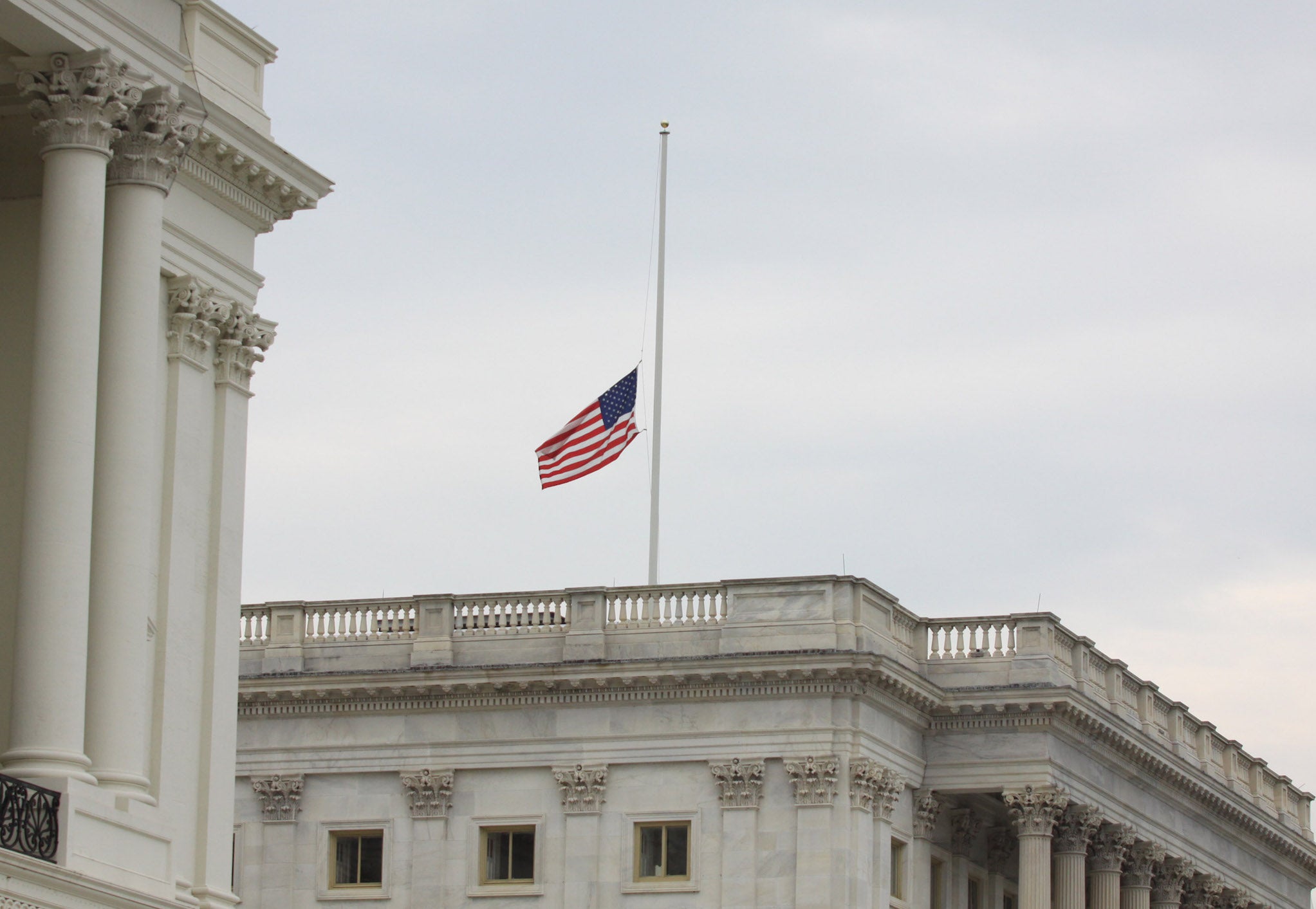 The flag is seen at half-staff at the US Capitol on Tuesday, 21 July 2015 on Capitol Hill in Washington.
