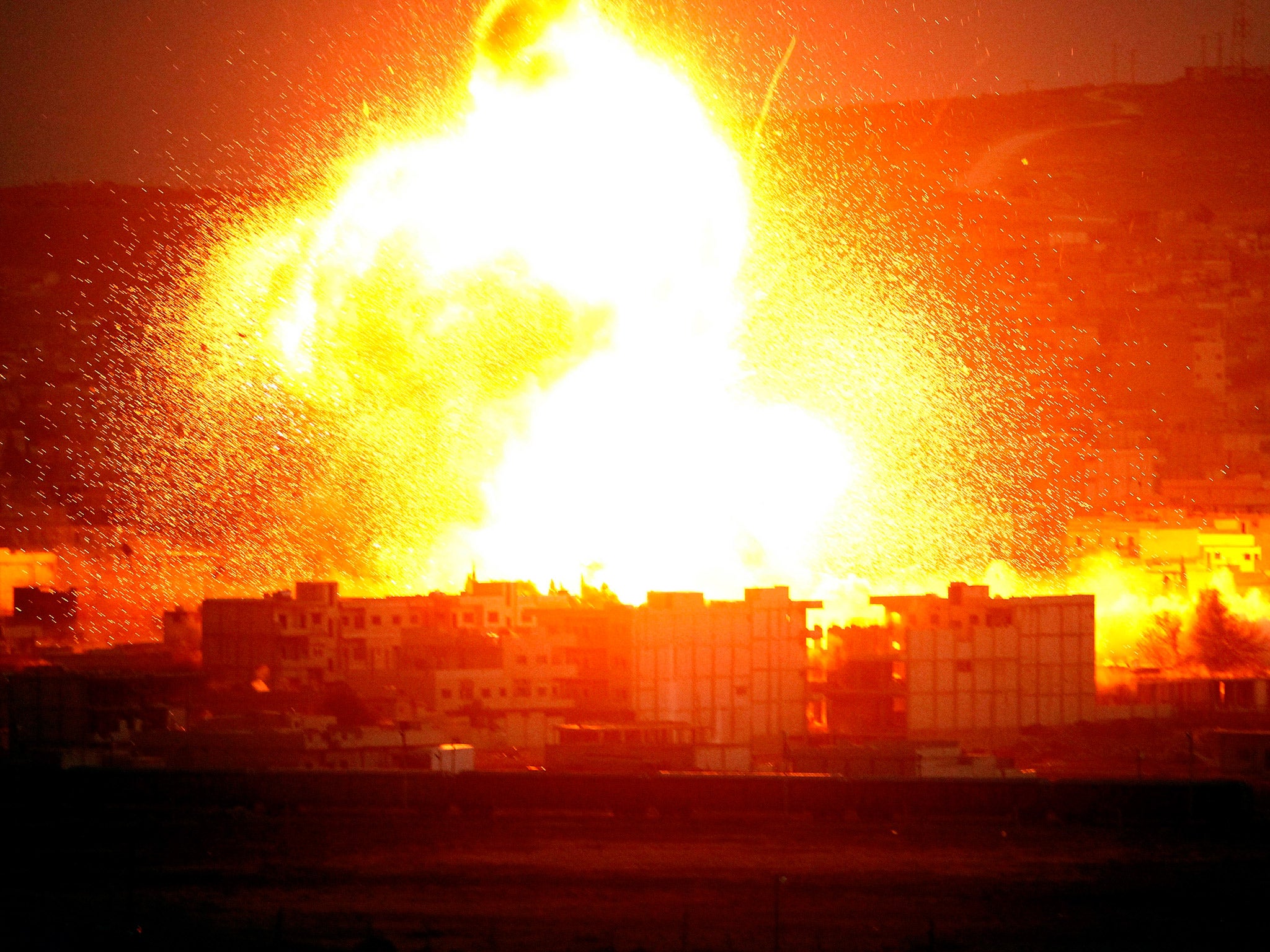 An explosion rocks the Syrian city of Kobani during an airstrike by the US-led coalition last year