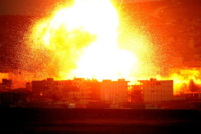 An explosion rocks the Syrian city of Kobani during an airstrike by the US-led coalition last year