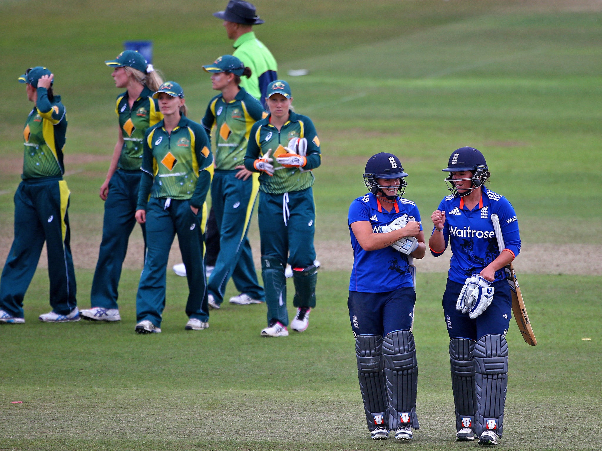 Georgia Elwiss and Katherine Brunt perform a celebratory fist-bump after steering England to victory in the first Ashes match at Taunton