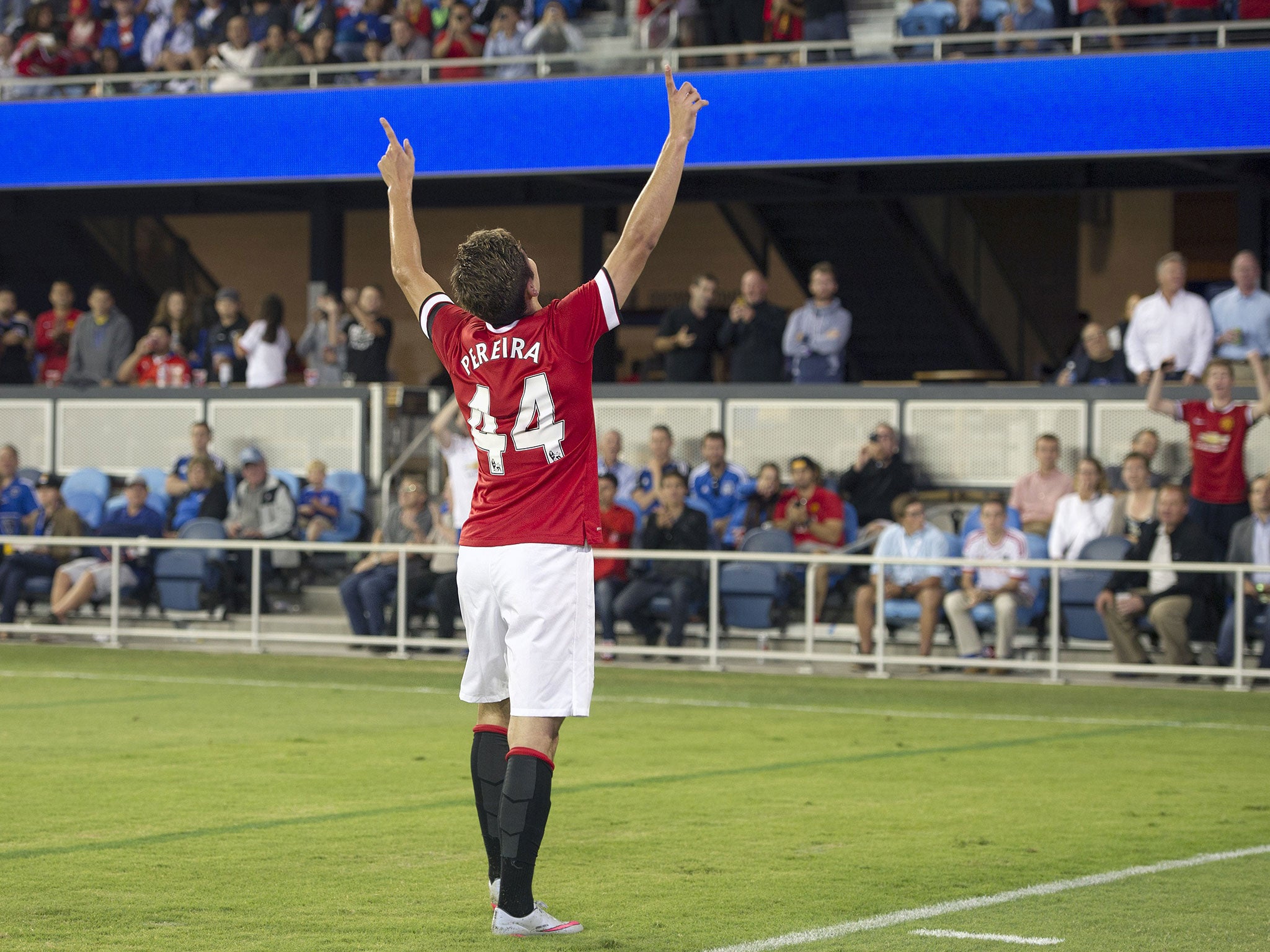 Andreas Pereira celebrates scoring United's third