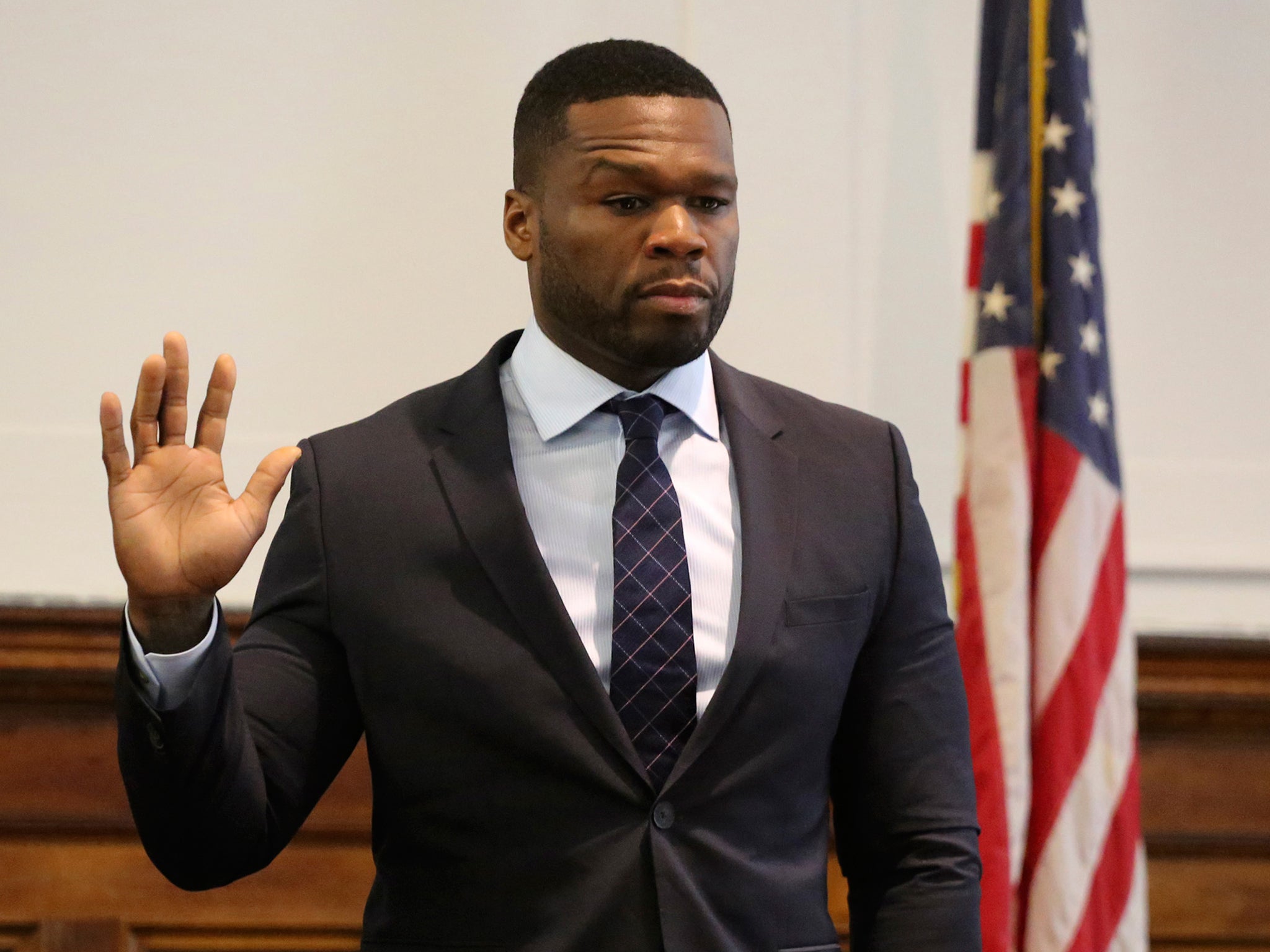 Rapper 50 Cent takes the oath as he appears in New York State Supreme Court in Manhattan, testifying in a lawsuit for a sex tape that was posted online. He recently filed for bankruptcy protection, reporting debts and assets in the range of $10 million to