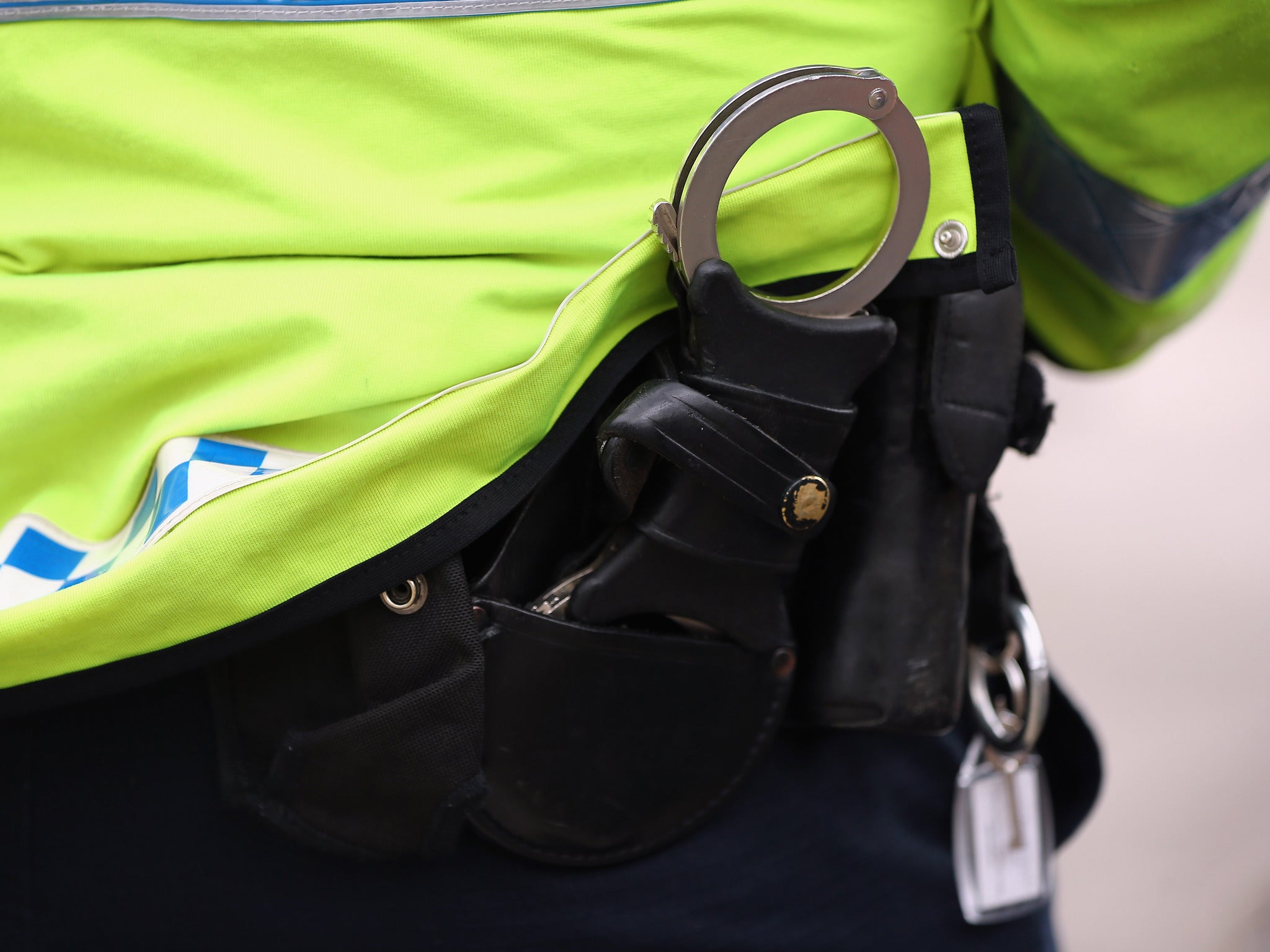 File image of police officer with handcuffs