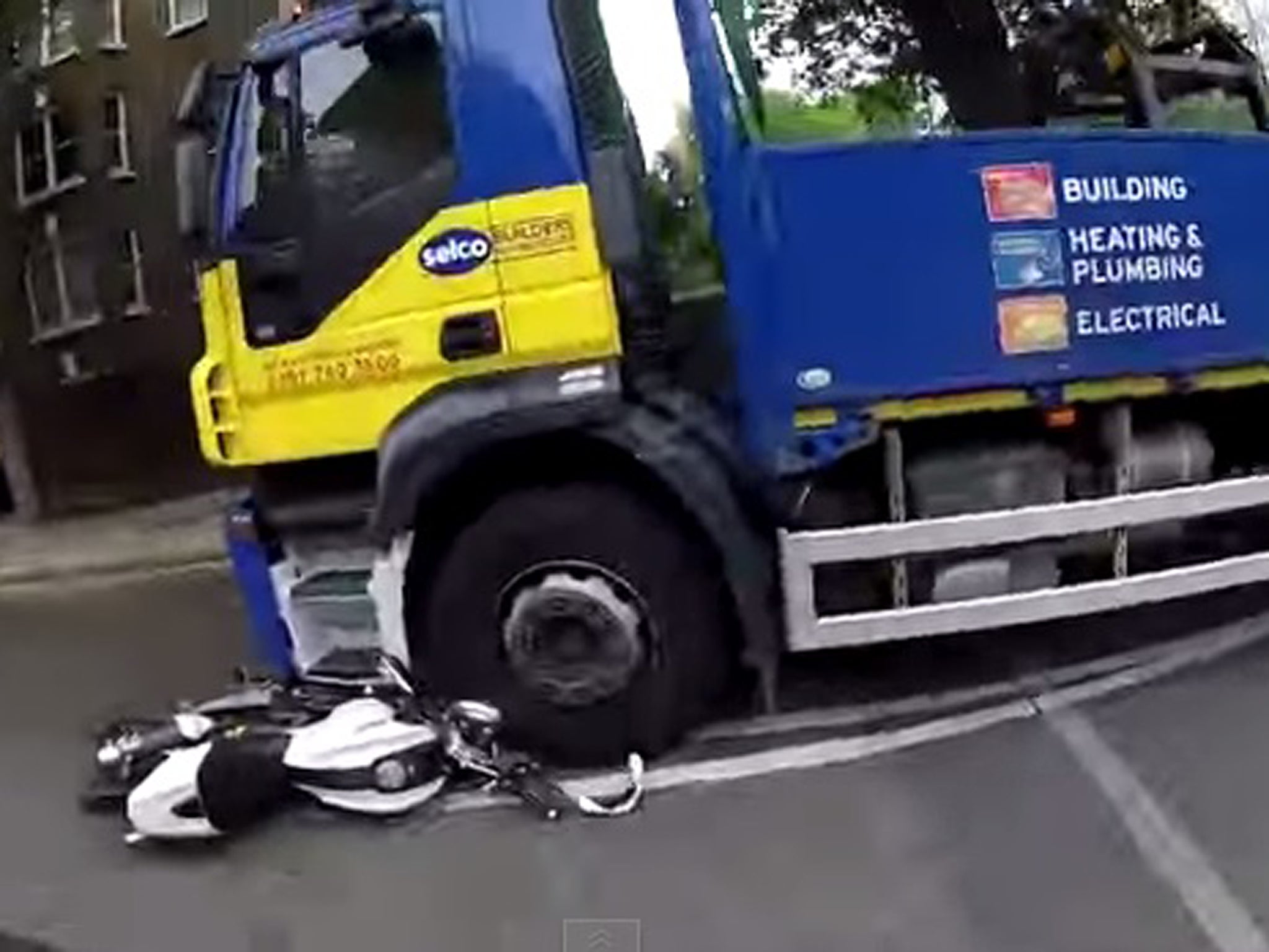 Helmet footage shows lucky escape as lorry driver fails to spot motorcyclist