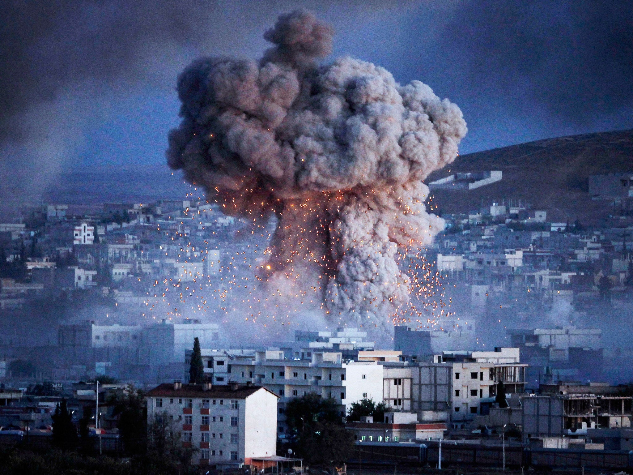 An explosion from a suicide car bomb attack rocks the city of Kobani in Syria, the least peaceful country in the world