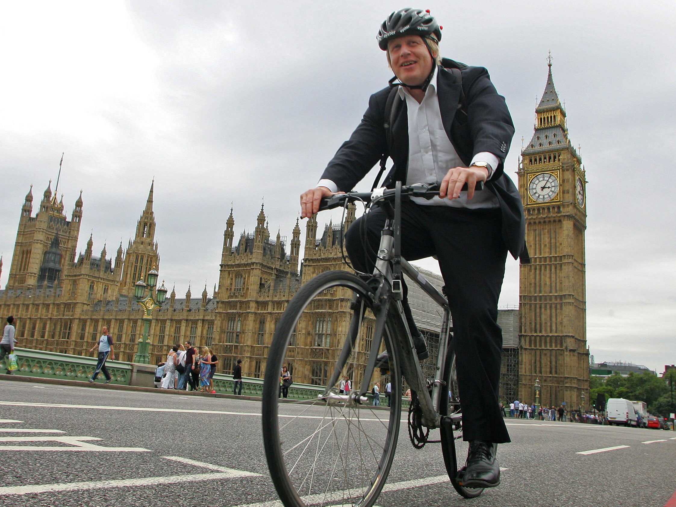 Boris Johnson cycles over Westminster Bridge