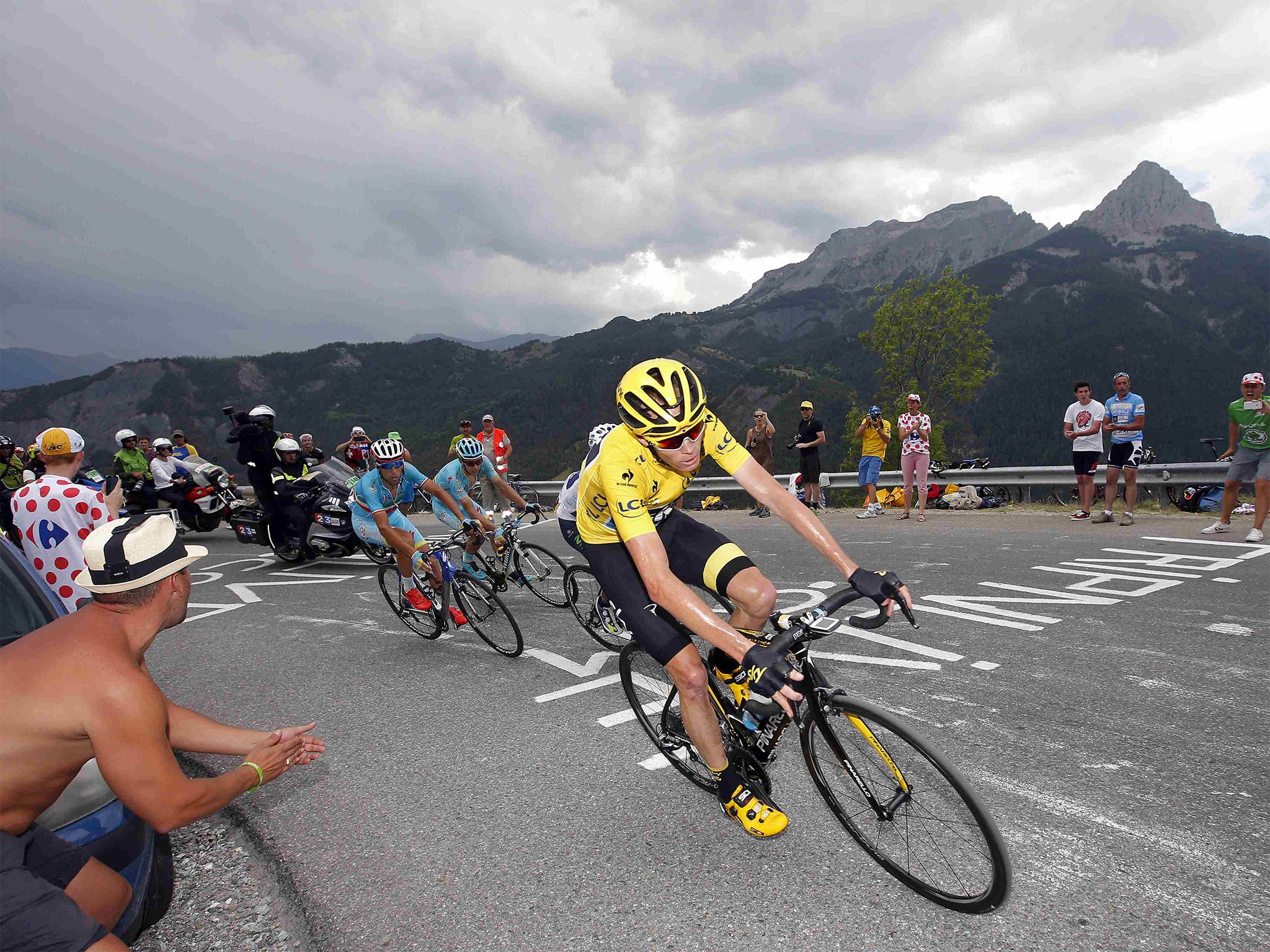 Chris Froome, wearing the leader’s yellow jersey, is followed by Vincenzo Nibali during the 17th stage of the Tour de France from Digne-les-Bains to Pra Loup in the Alps