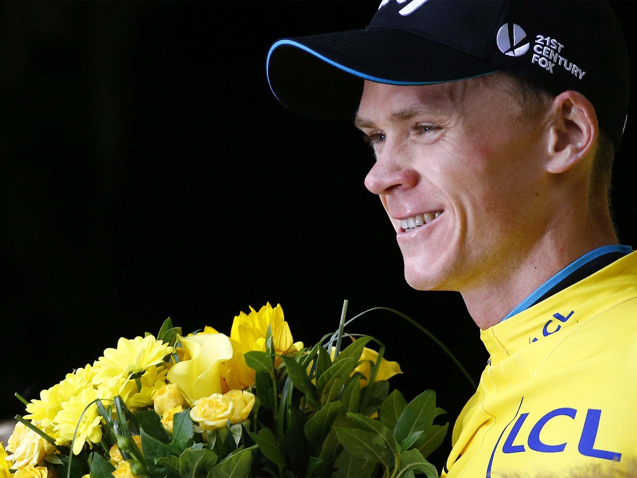 Froome is all smiles after retaining the yellow jersey - and his lead of over three minutes - on Wednesday