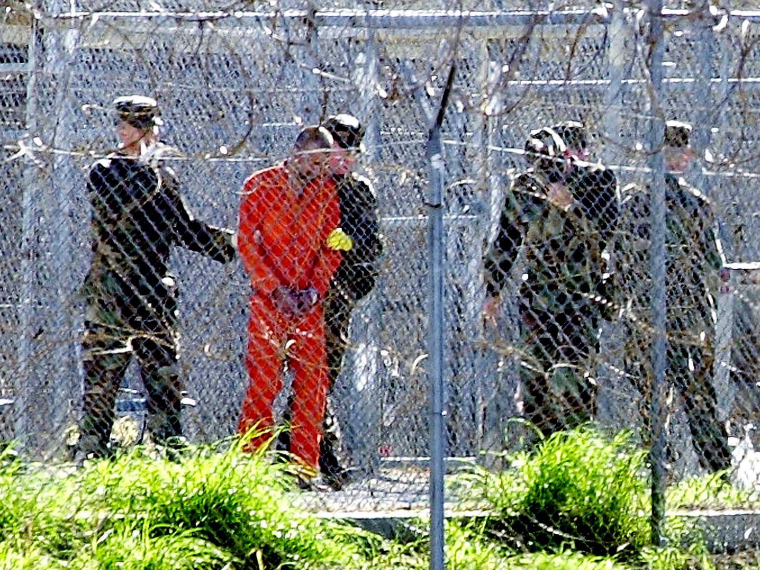 A Guantanamo detainee at Camp X-Ray in the detention facility