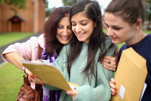 Scenes like this will be taking place across the country when A-Level students get their results next month, determining their choice of university (Getty)