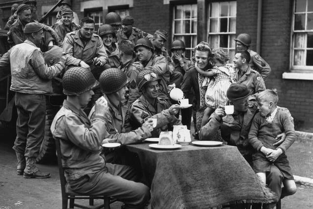 Harmless joshing?: An Englishwoman serves tea to American troops outside her house