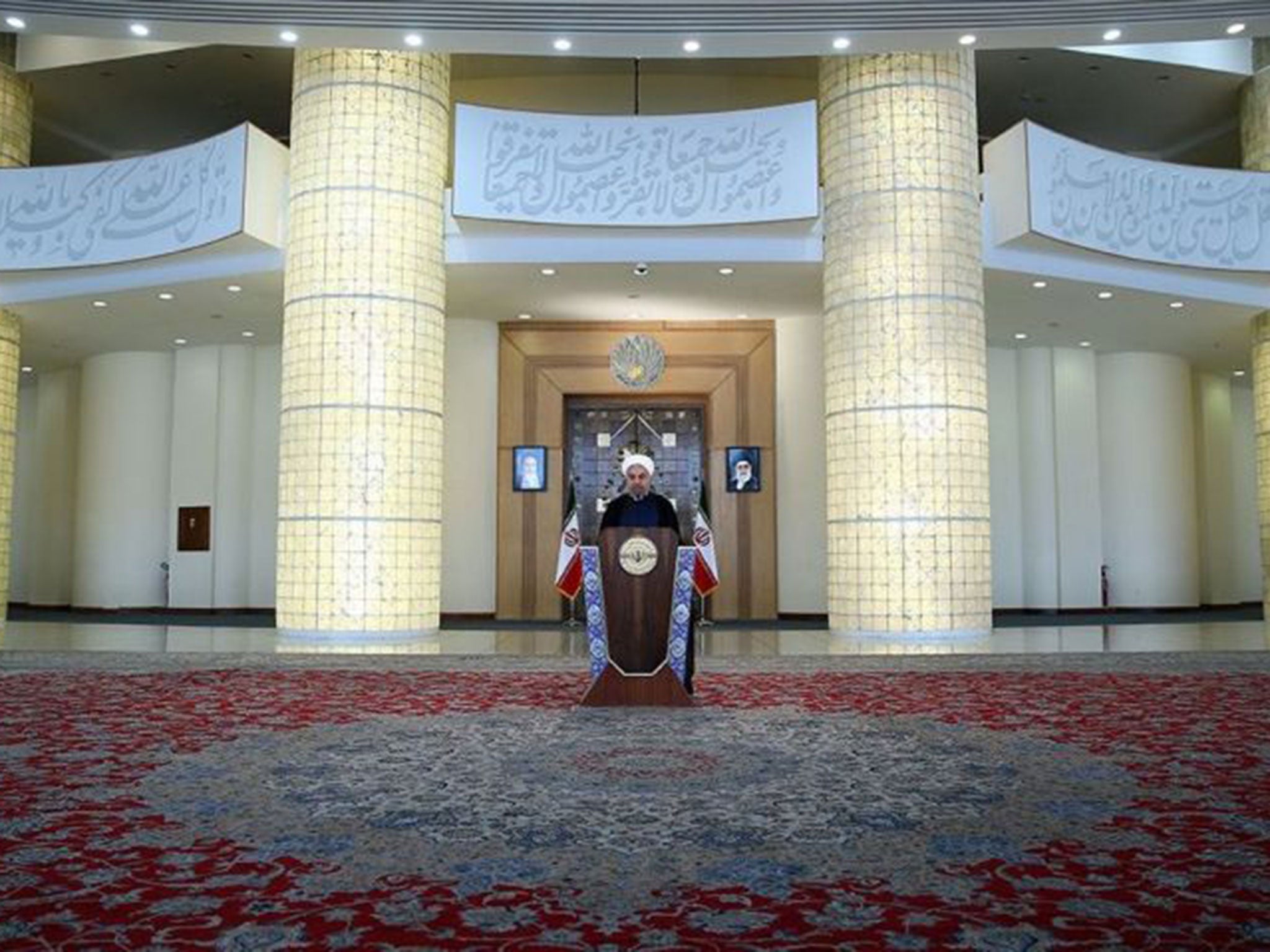 Iranian President Hassan Rouhani delivering a statement in Tehran