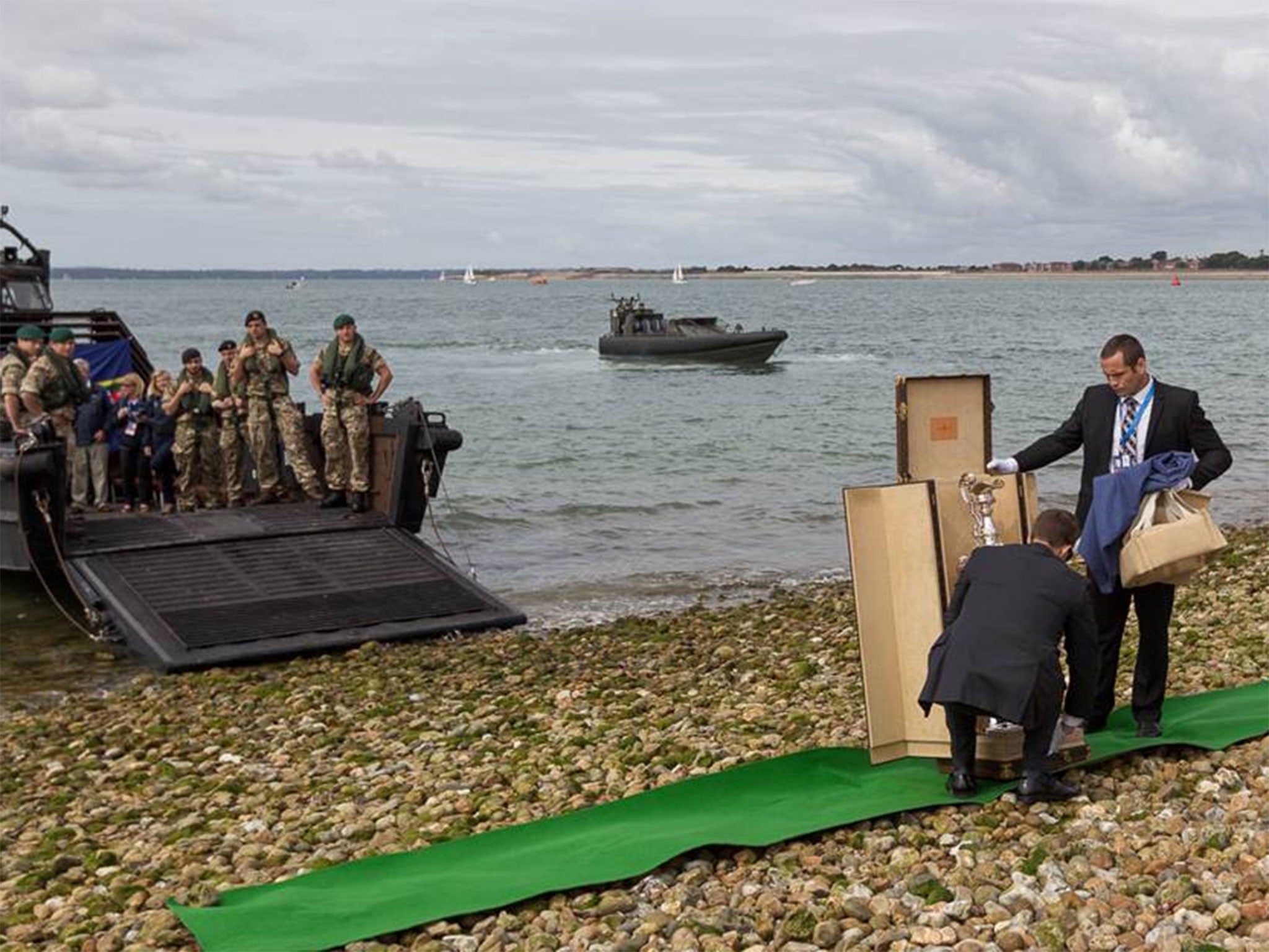 Green Berets deliver the America's Cup to the beach at Southsea ahead of the World Series racing to be staged on Saturday and Sunday with Britain’s Land Rover BAR team sitting in the favourite's chair