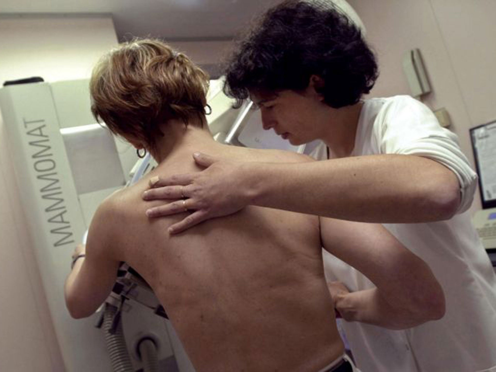 A nurse performs a mammography