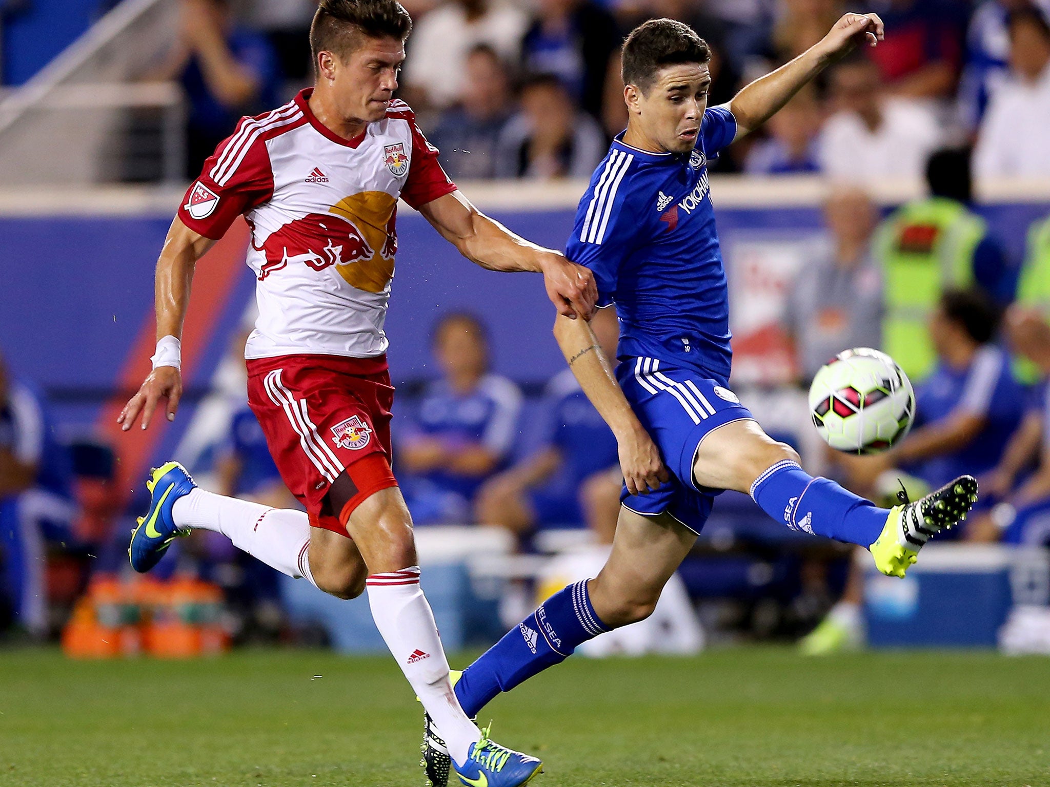 Chelsea’s Oscar tries to shield the ball from Michael da Fonte, of the New York Red Bulls, in Harrison, New Jersey, where the visitors lost 4-2