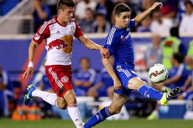 Chelsea’s Oscar tries to shield the ball from Michael da Fonte, of the New York Red Bulls, in Harrison, New Jersey, where the visitors lost 4-2 
