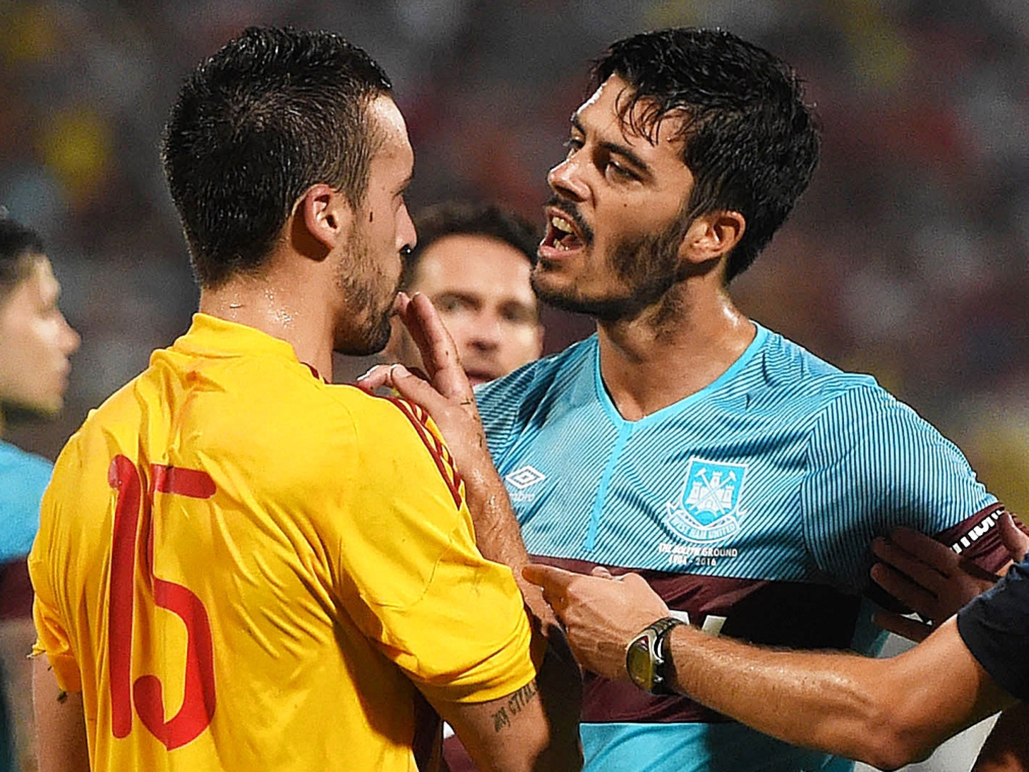 West Ham's James Tomkins argues with Nikola Vukanac after he was sent off