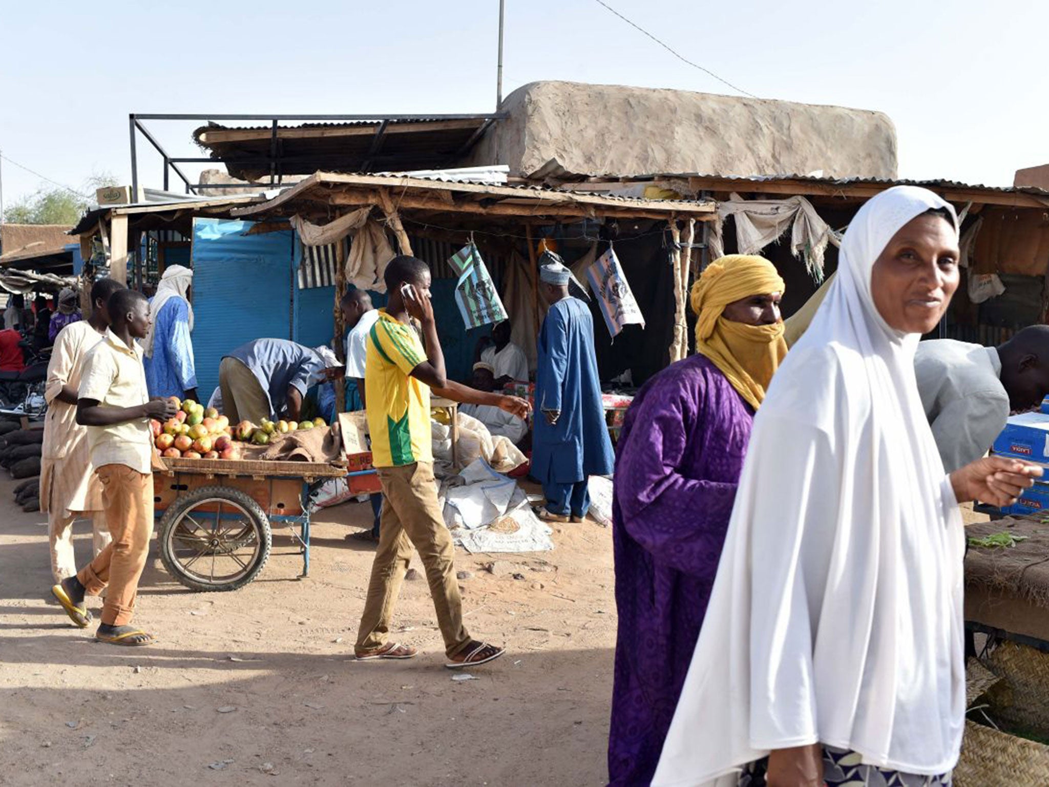 People shop at a market of the central Niger city of Agadez on May 29, 2015.