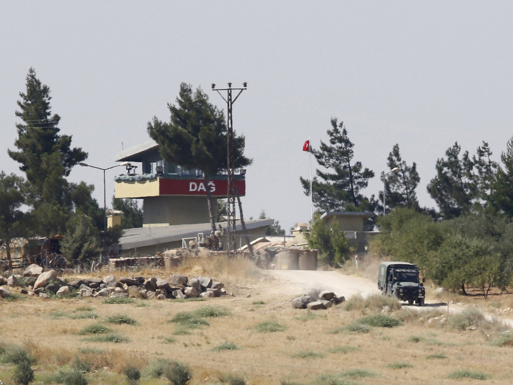 A Turkish military vehicle leaves from the Dag military post, which was attacked by Islamic State militants on Thursday