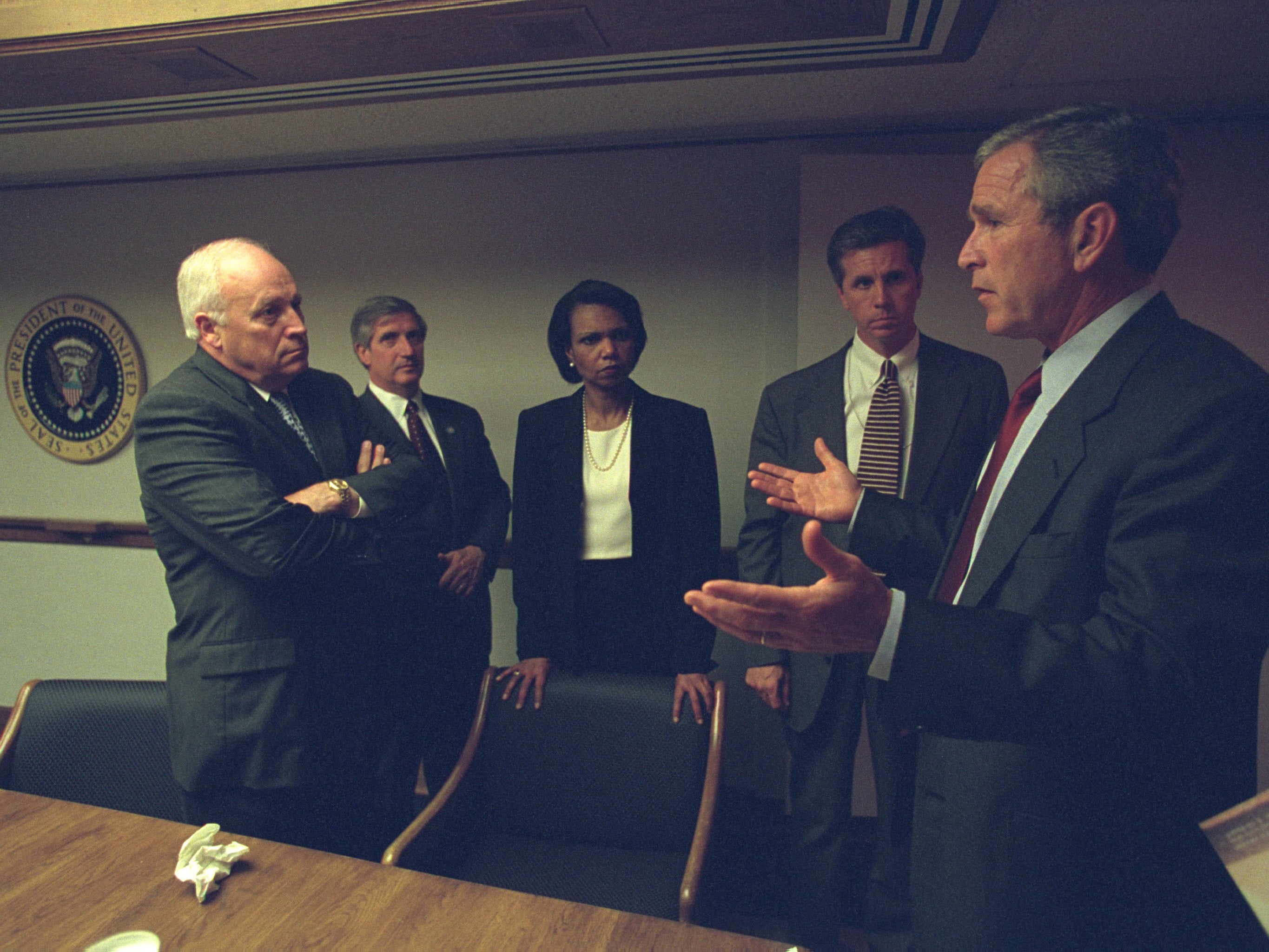 President Bush speaks with senior staff