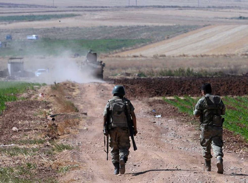 Turkish soldiers patrol near the Syrian border