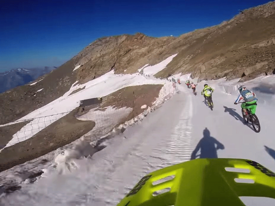 Dozens of cyclists were seen crashing and sliding down the mountain in the footage