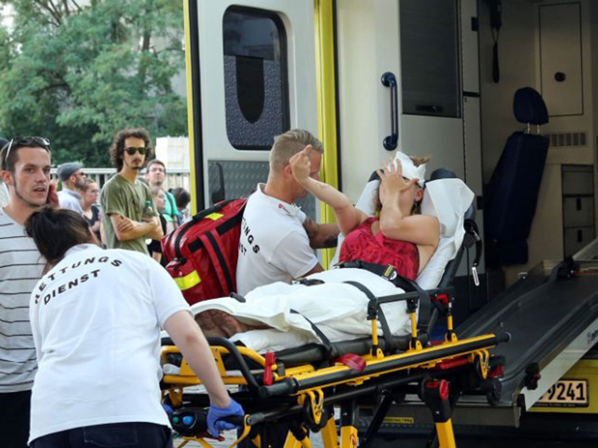 An injured counter protestor is taken away in an ambulance following the violent clashes