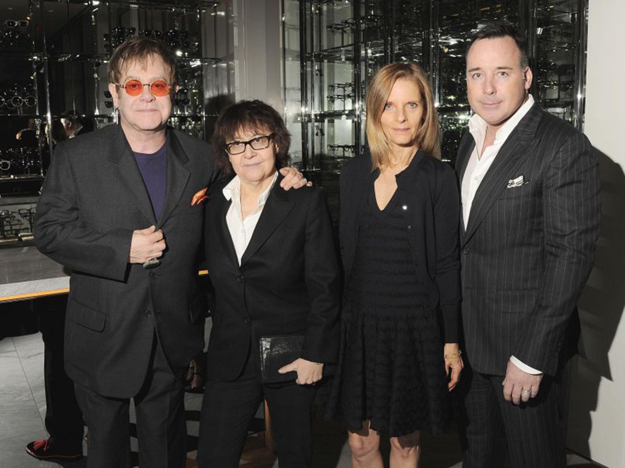 Ingrid Sischy flanked by Sandra Brant and Elton John