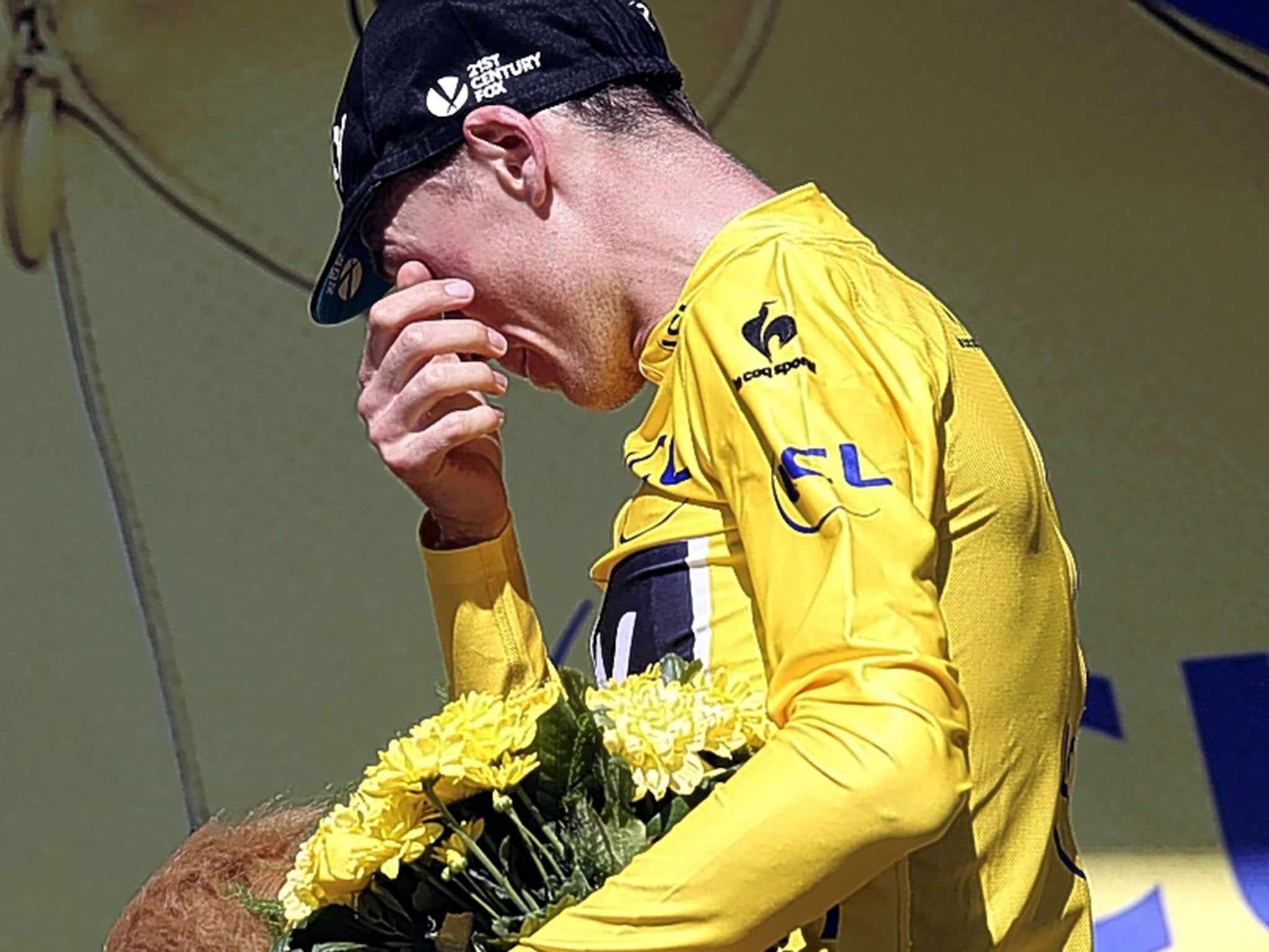 An emotional Chris Froome on the podium