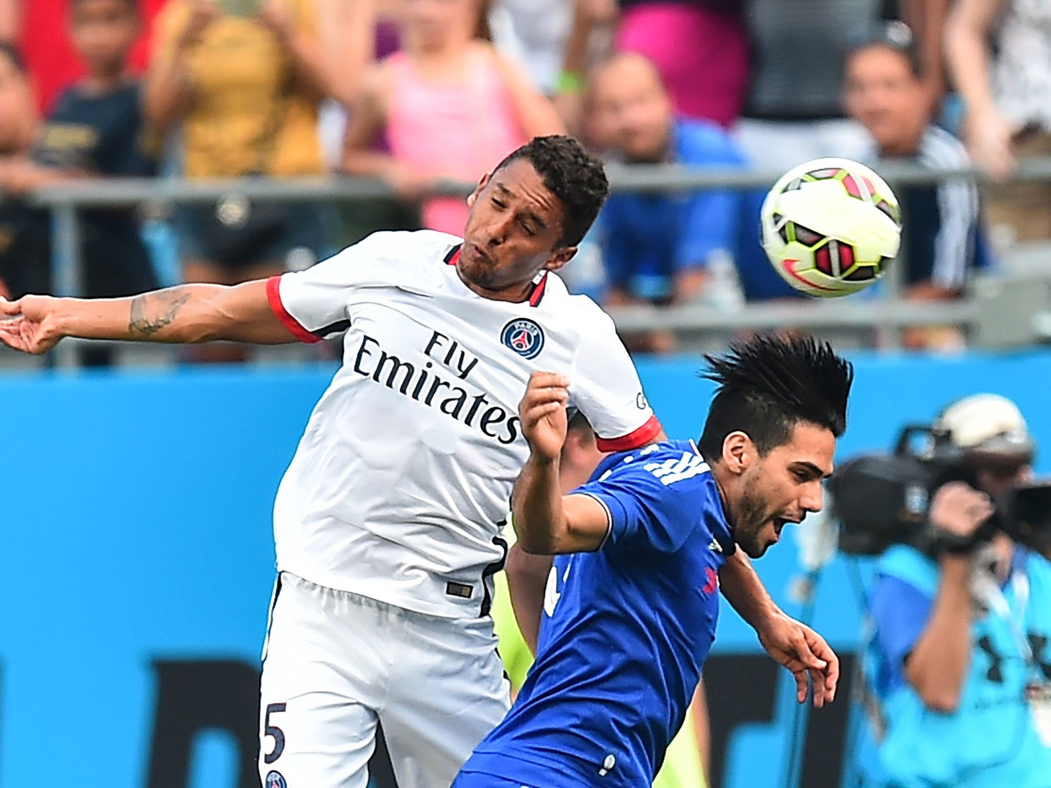 Radamel Falcao (right) challenges for the ball on his Chelsea debut against PSG last week
