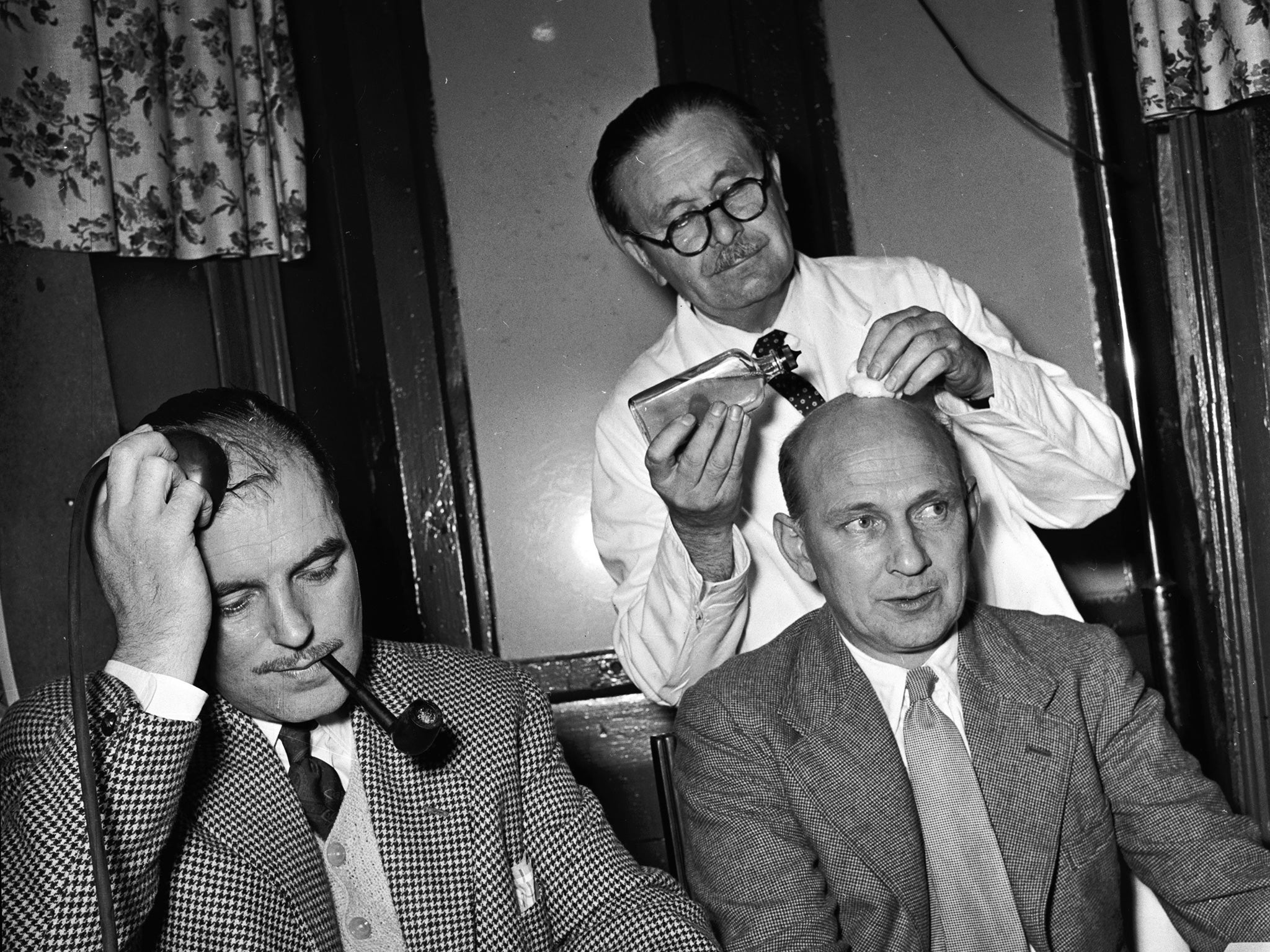 Clients at the Curly Boys Club in London try to reverse their destiny (Hulton Archive/Getty)