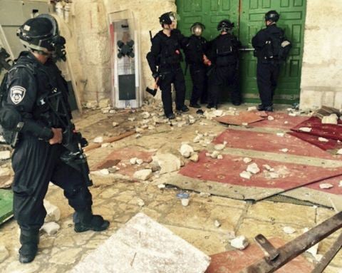 Police at the entrance of al-Asqa mosque in East Jerusalem