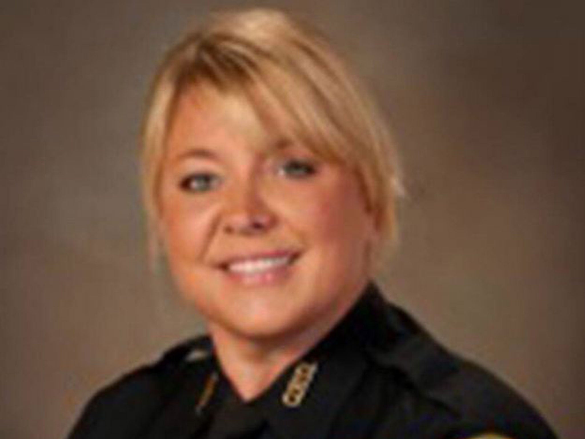 Sgt Erica Hay was pictured sitting down and sharing a meal with a homeless person