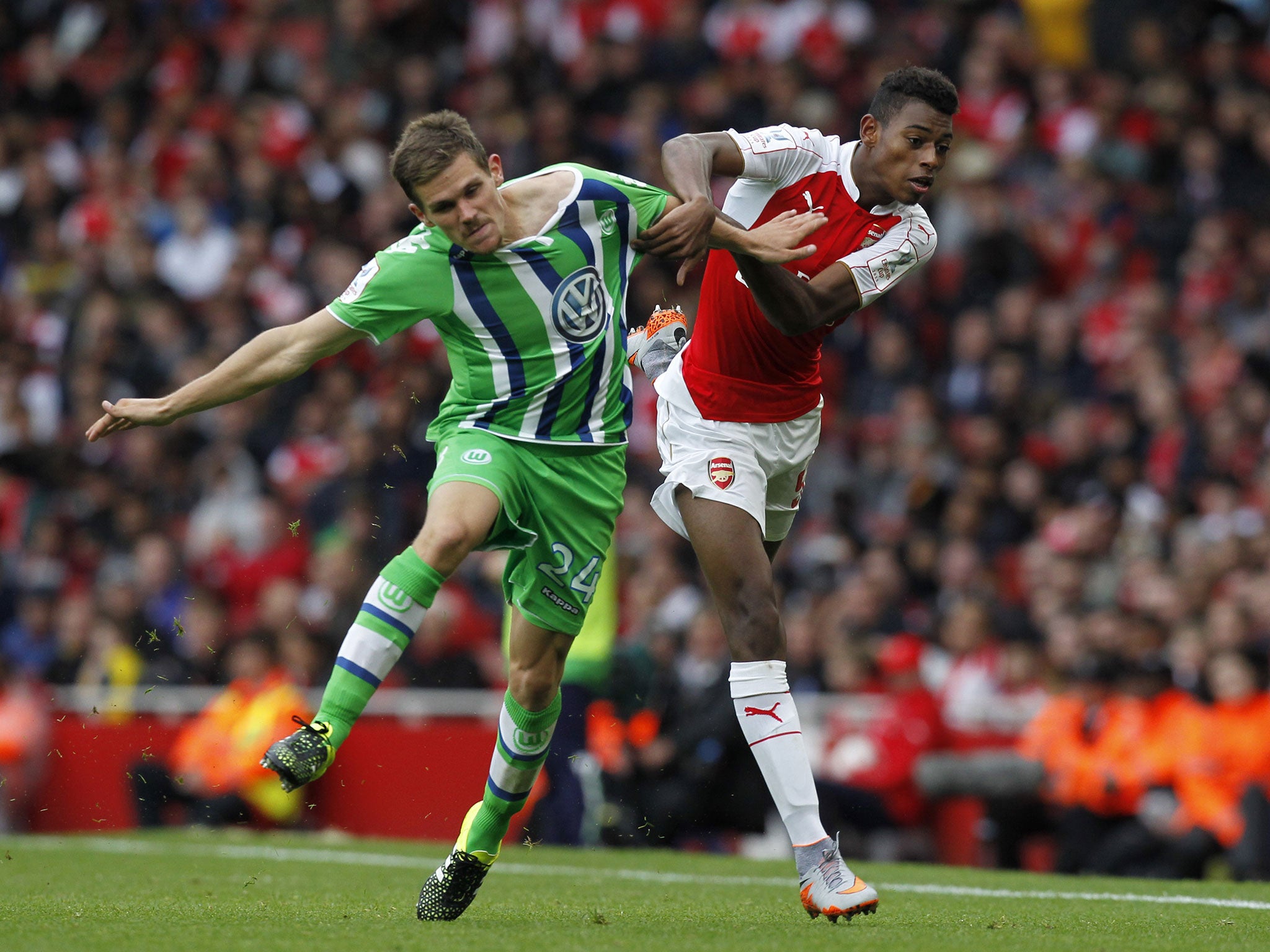 Jeff Reine-Adelaide competes with Sebastian Jung for the ball