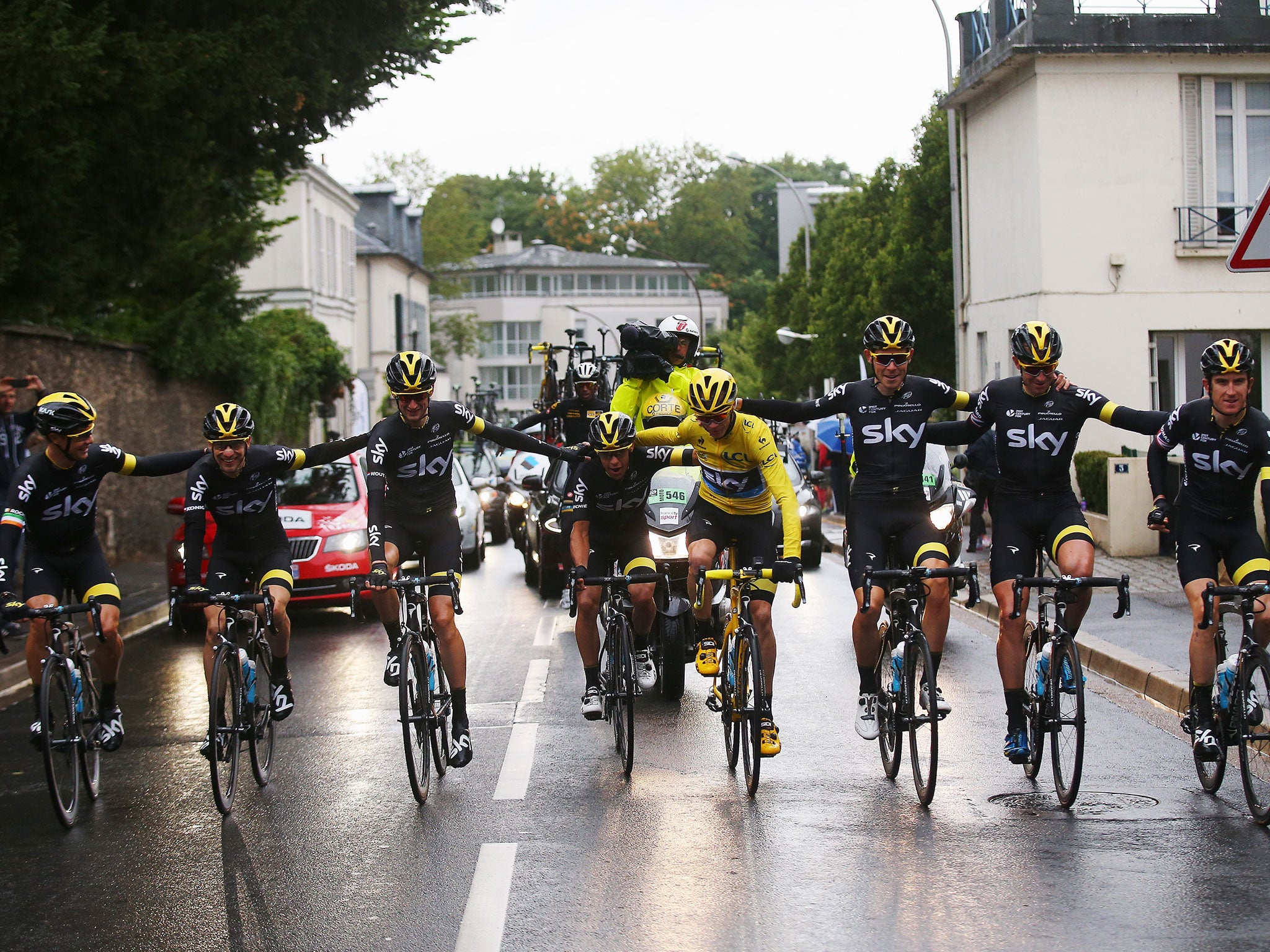 Chris Froome rides into Paris with the rest of Team Sky