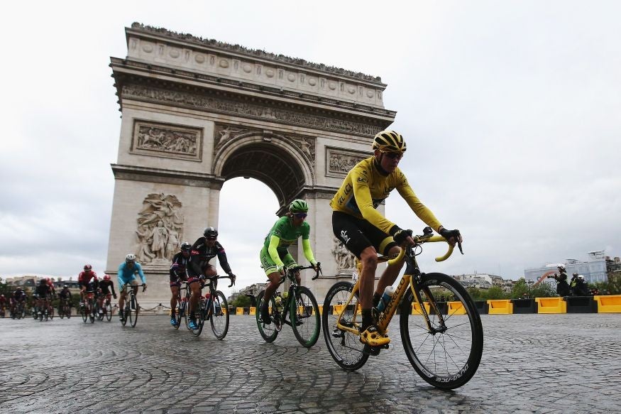 Chris Froome rides past the Arc de Triomphe during the final stage of the race.