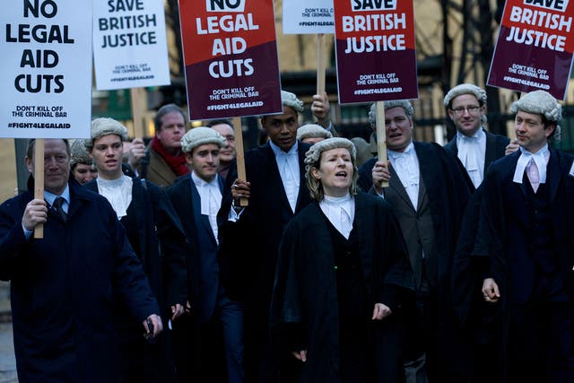 Lawyers have launched legal action and strikes over funding cuts 