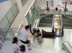 Mother pushes toddler to safety before being killed on escalator