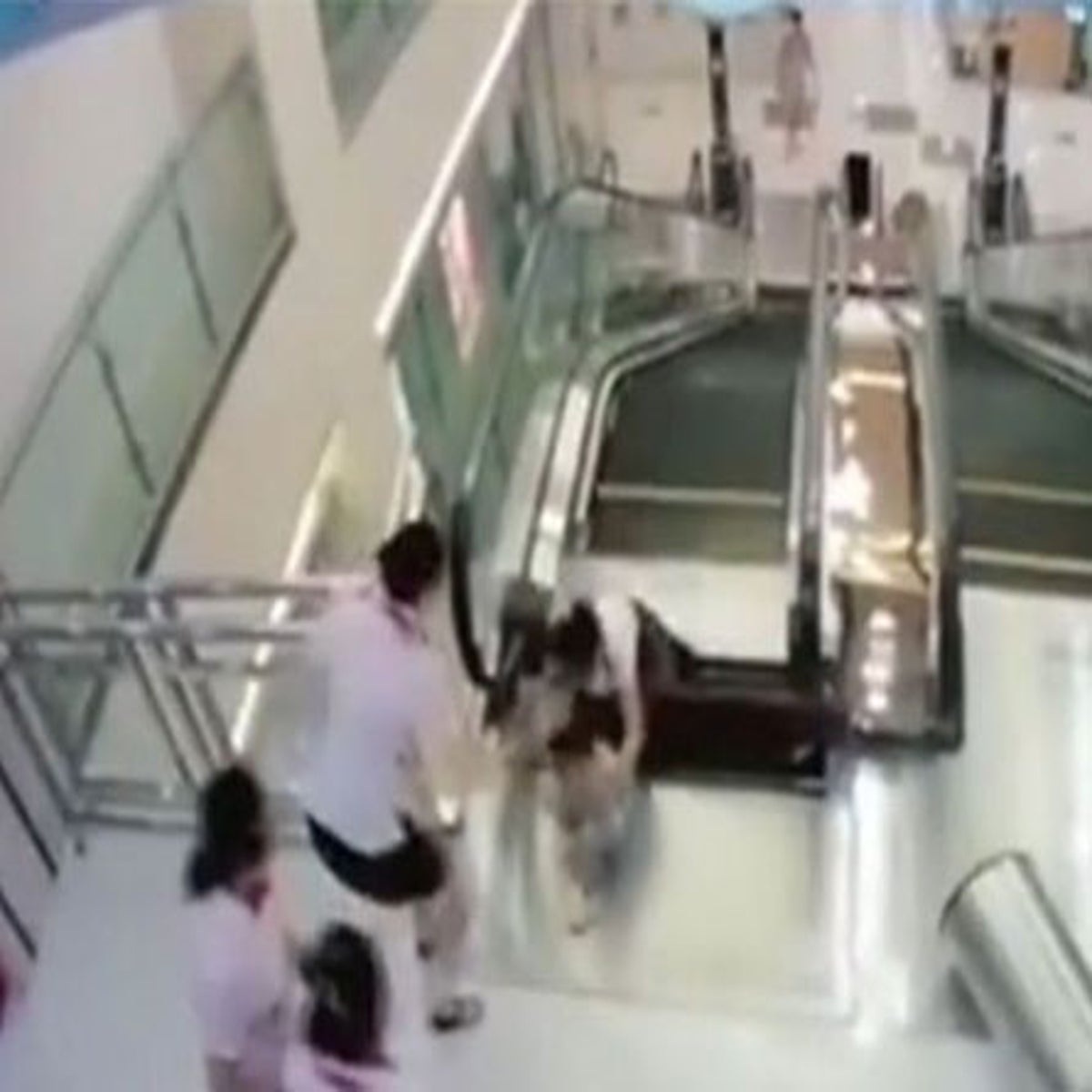 Chinese escalator swallows up mother in Hubei province department store |  The Independent | The Independent