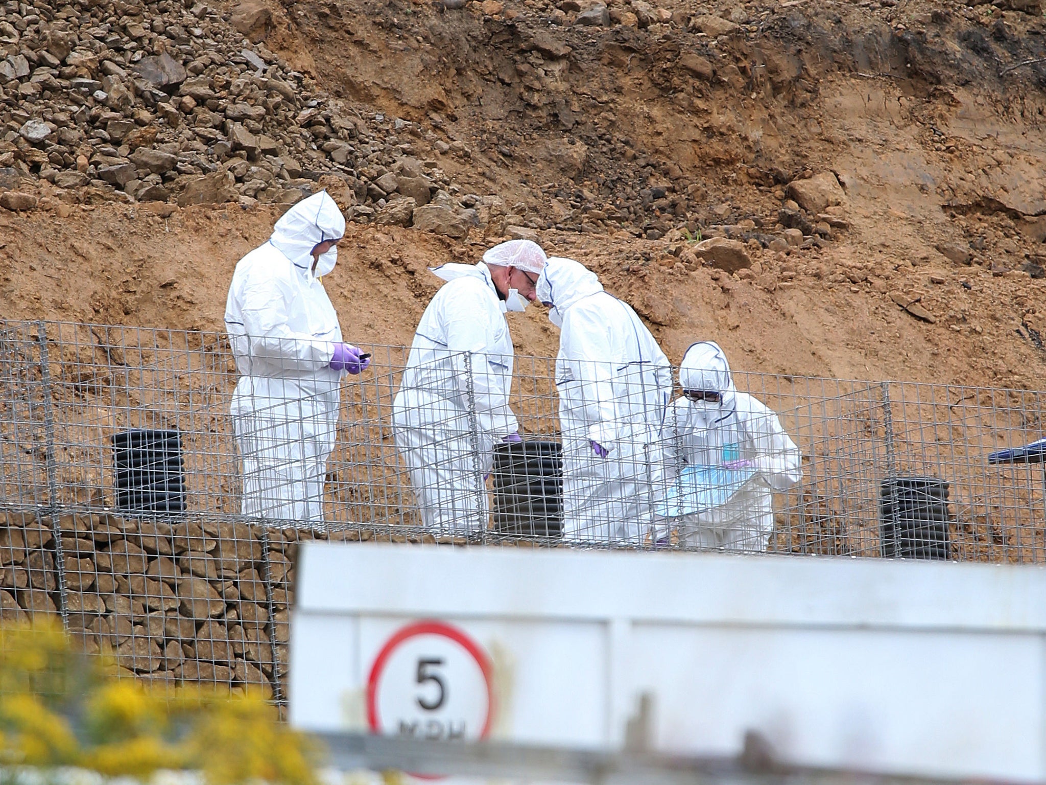 Police forensic officers search a site in Barnsley