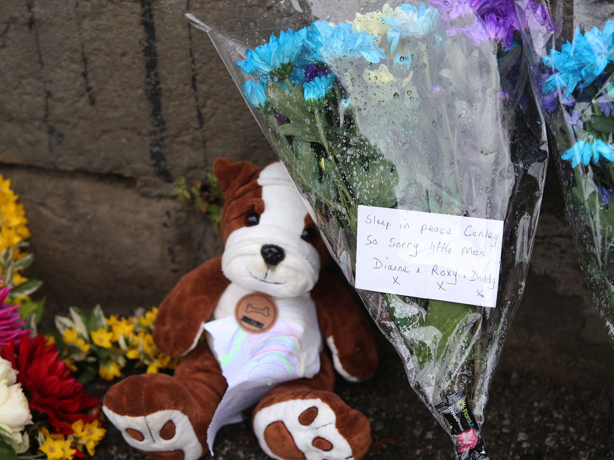 Floral tributes left near a construction site on Bank End Road in Worsbrough, Barnsley, for Conley Thompson