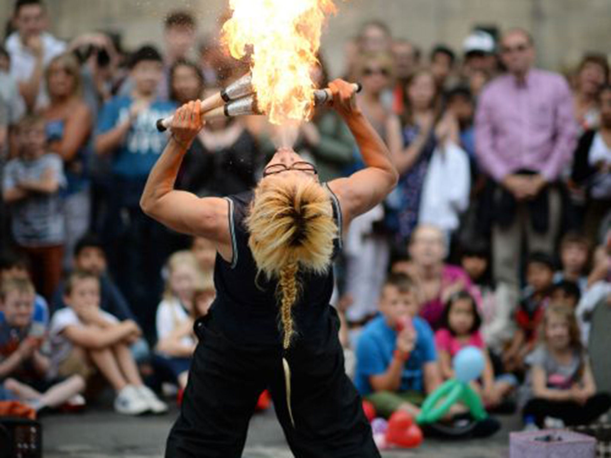 A street entertainer performs on Edinburgh's Royal Mile