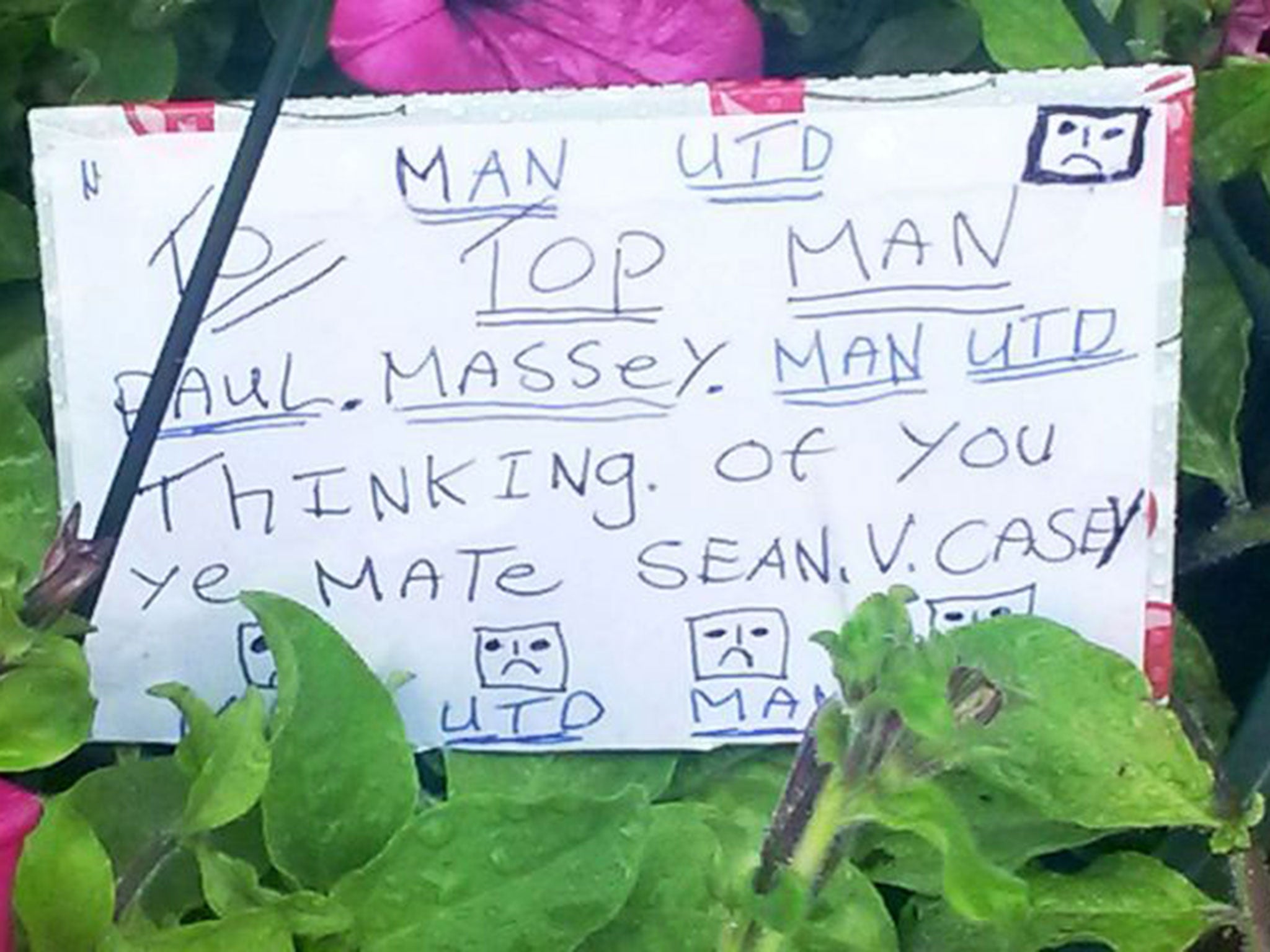 A floral tribute left near the scene in Clifton, Salford, after businessman Paul Massey was shot dead at his house last night